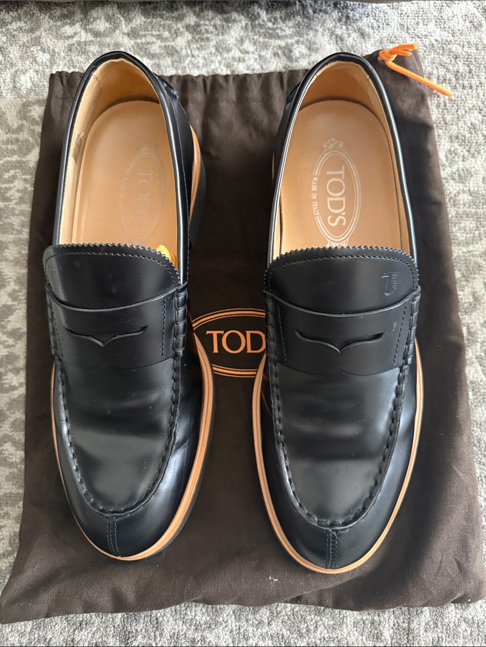 Tod's Black Leather Penny Loafers with Tan Soles
